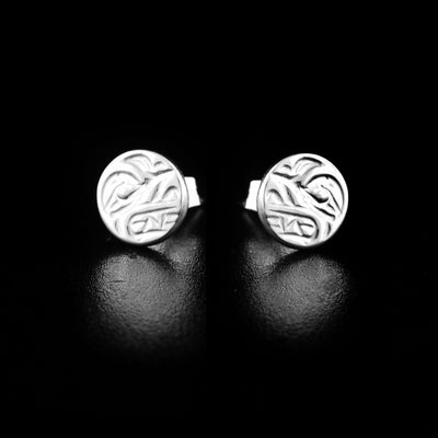 Mini wolf cast studs handcrafted by Kwakwaka'wakw artist Carrie Matilpi. Made of sterling silver. Each earring measures approximately 0.25" in diameter.