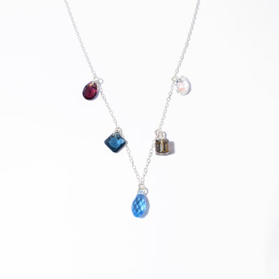 Dazzling multi-shape crystal necklace handcrafted by artist Debra Nelson. Made of sterling silver and Swarovski Crystal. Necklace available in 16" and 17".
