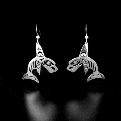 Stunning orca earrings by Tahltan artist Grant Pauls. Made of sterling silver. Each earring measures 1.95" x 0.90" including hook.