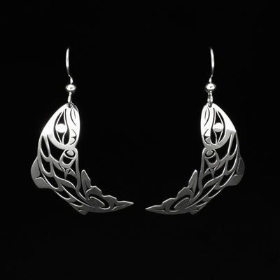 Stunning pierced salmon earrings by Tahltan artist Grant Pauls. Made of sterling silver. Each earring measures 1.75" x 0.50" including hook.