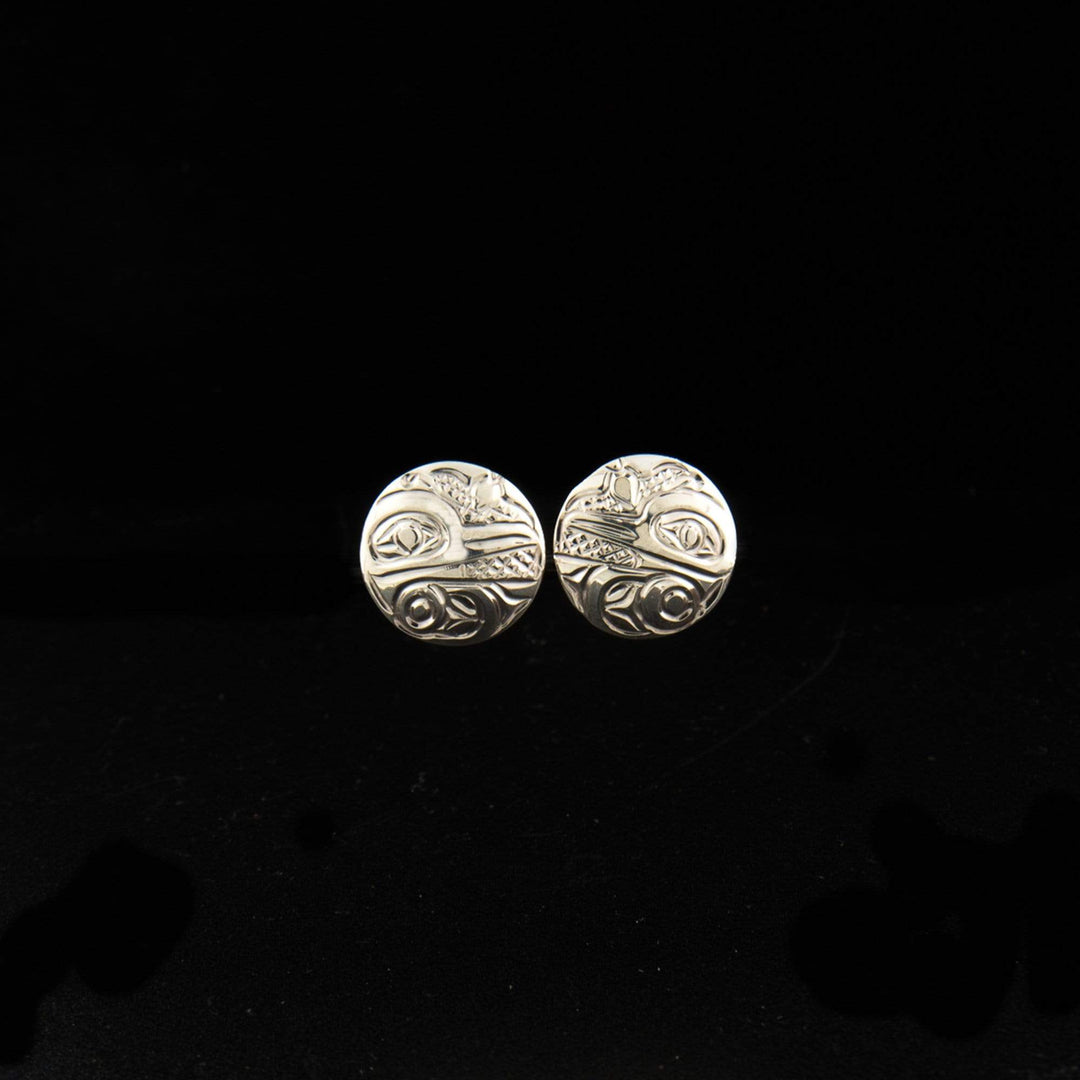 Sterling silver round hummingbird studs hand-carved by Kwakwaka'wakw artist Carrie Matilpi. Each earring is 3/8" in diameter.