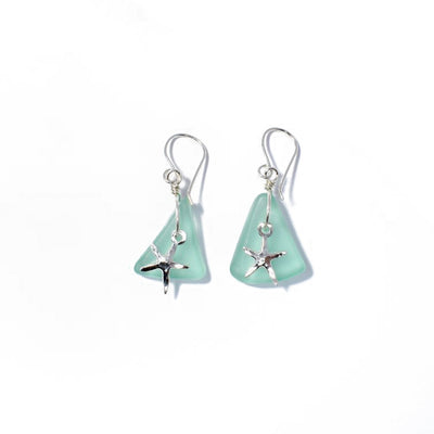 Sterling Silver Sea Star Earrings handcrafted by artist Kim Naylor. Made of sea glass and sterling silver. Each earring measures 1.50" x 0.75" inlcuding the hook.