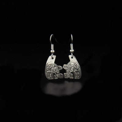 Sterling silver small orca-shaped earrings hand-carved by Coast Salish artist Gilbert Pat. Each earring measures 1.50" x 0.56" including hook.