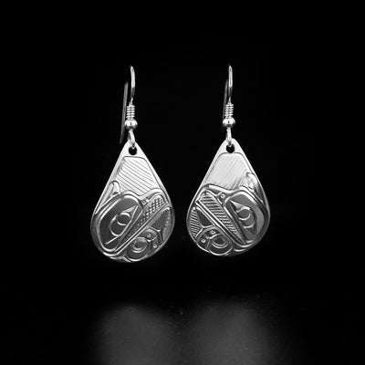 Sterling silver teardrop raven earrings hand-carved by Coast Salish and Cree artist Richard Lang. Each earring measures 1.75" x 0.75" including the hook.