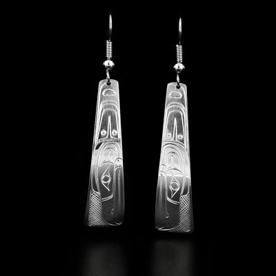 These raven earrings are triangle shaped and have the profile of a raven's head with a large carved feather facing downwards.