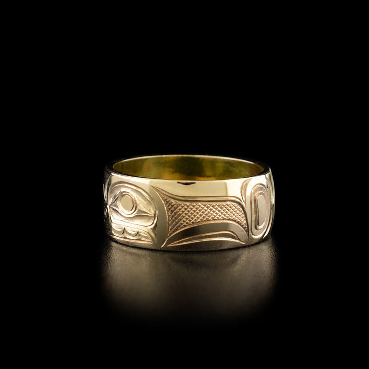 Right angle photo shows the side of the ring with intricate hand-carved designs.