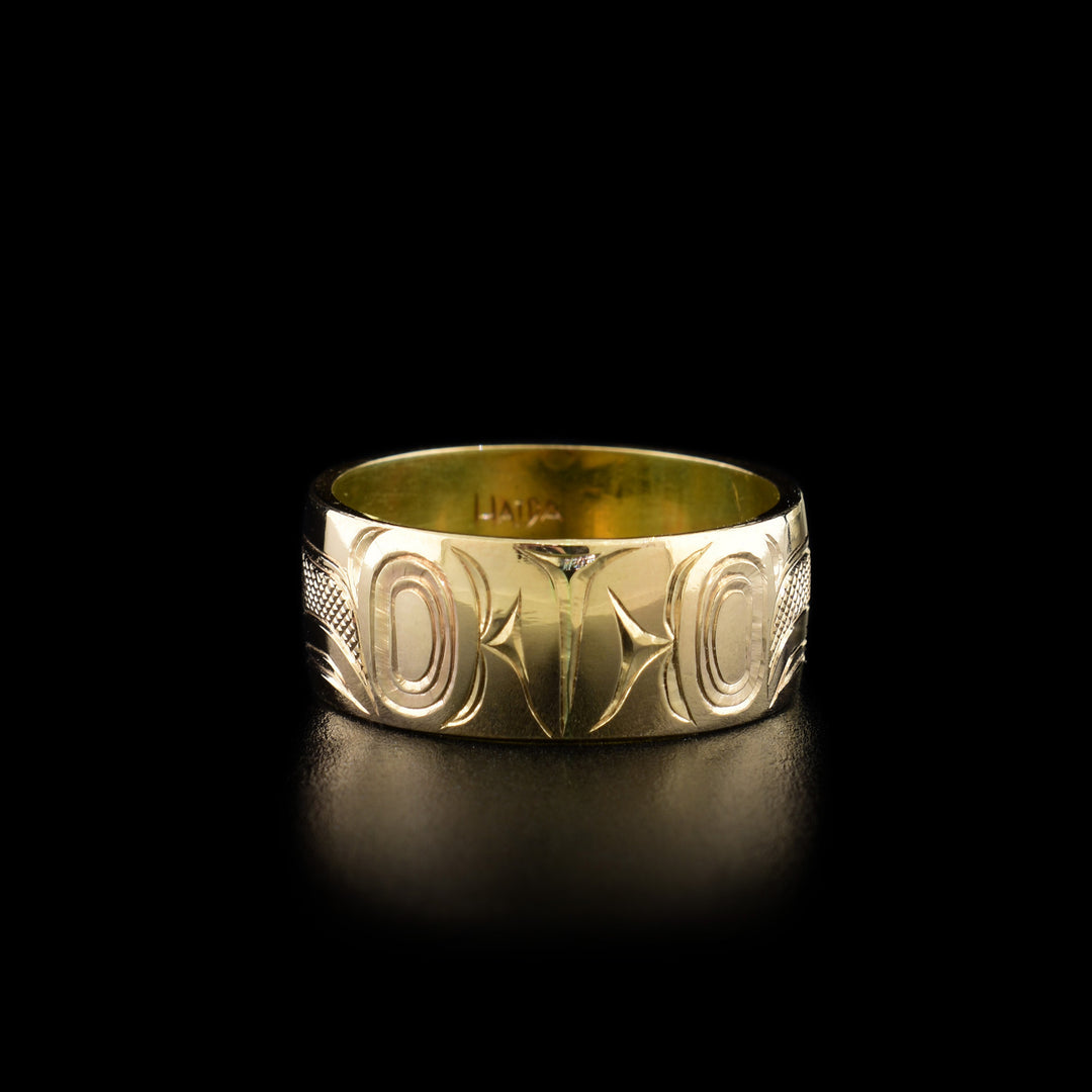 Third photo shows the back of the ring with intricate hand-carved designs.
