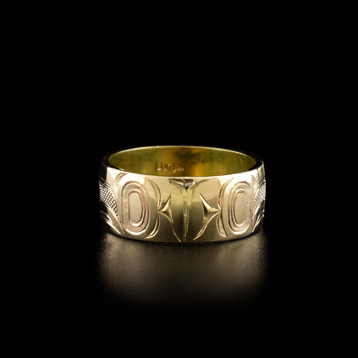Third photo shows the back of the ring with intricate hand-carved designs.