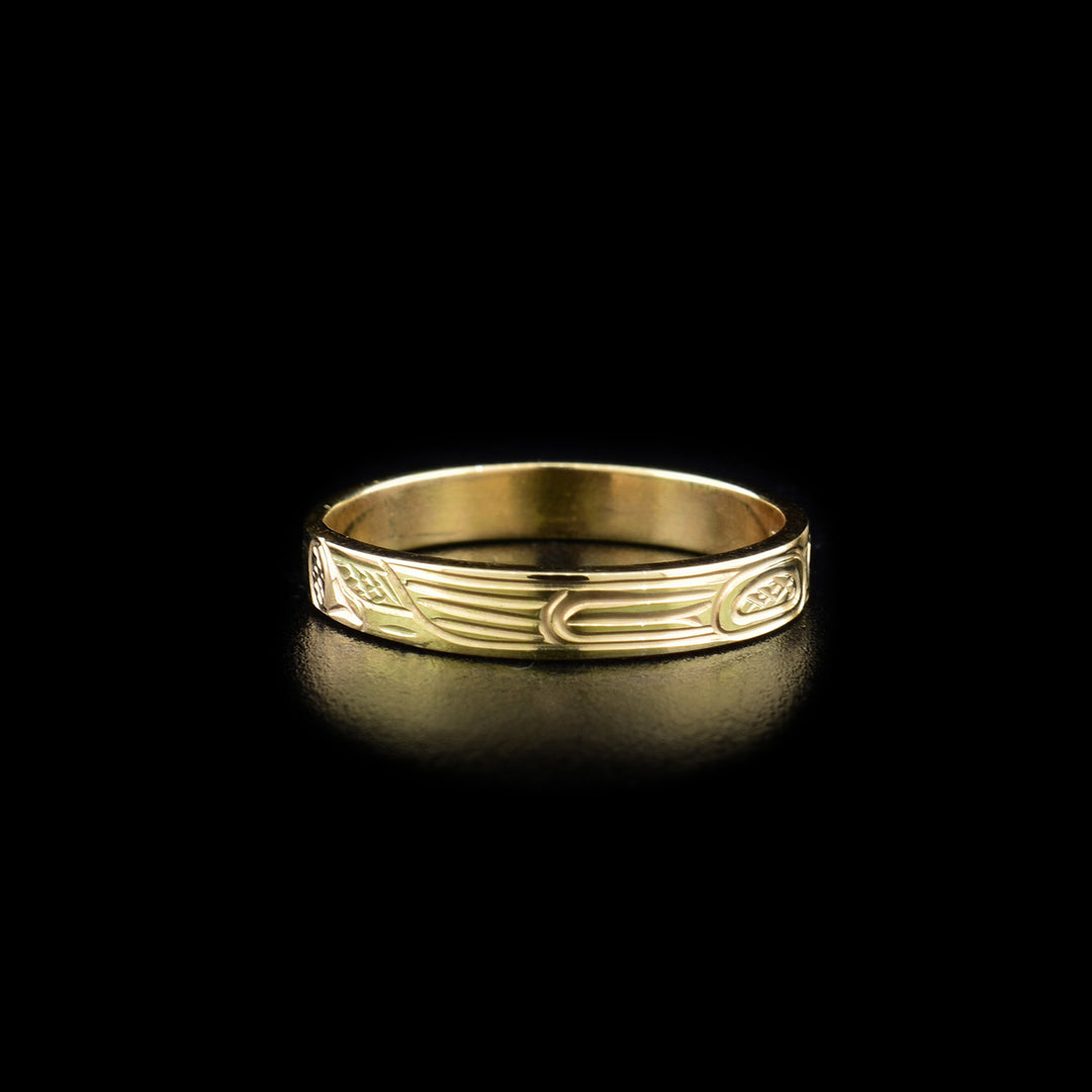 Right side of ring showing hummingbird body. Background is cross-hatching.