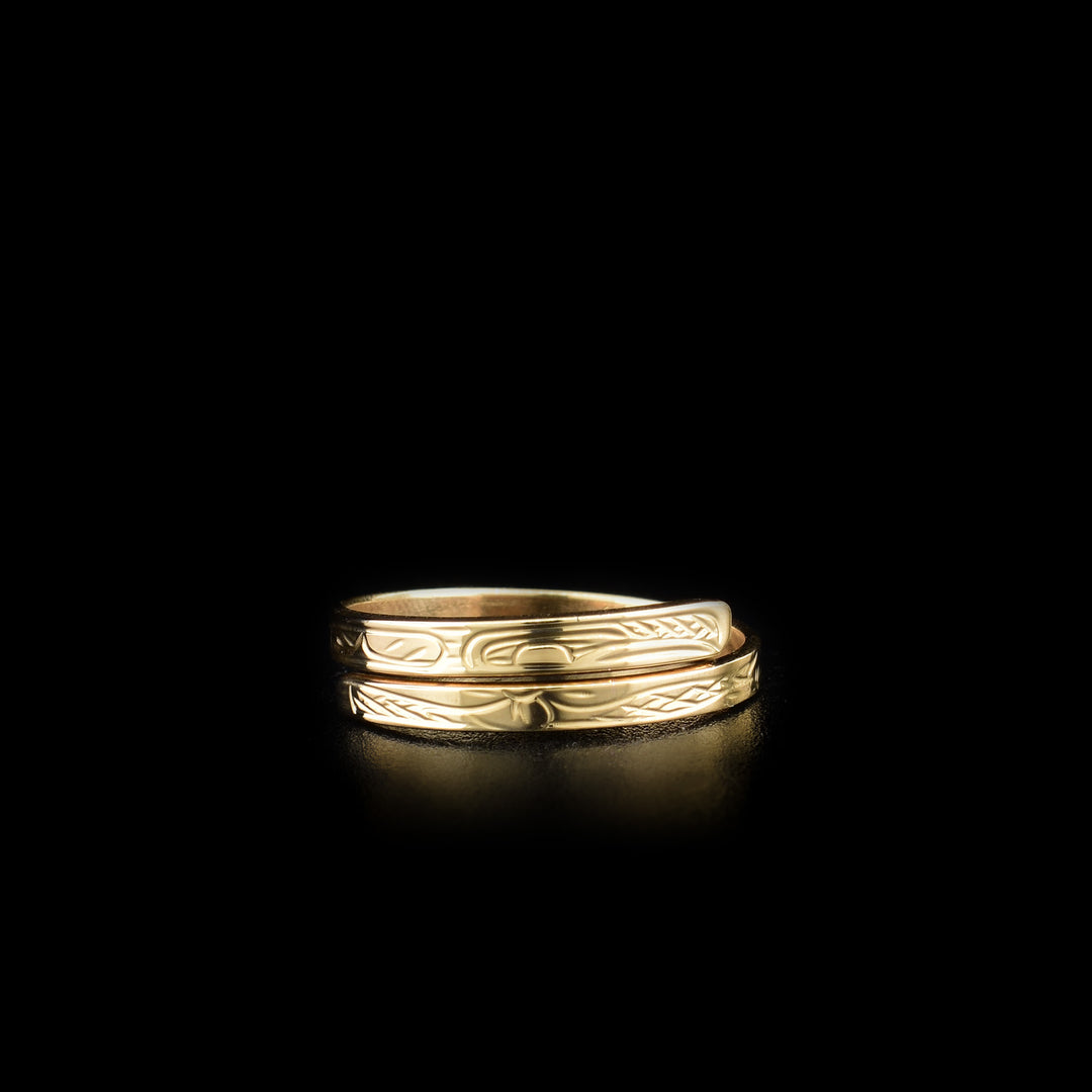 This Hummingbird ring is made from 14K gold and has a thin band that wraps around the finger twice. There is a depiction of the Hummingbird carved into the surface of the band.