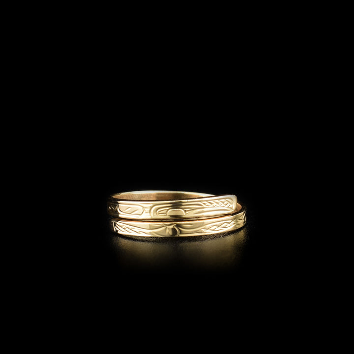 This Hummingbird ring is made from 14K gold and has a thin band that wraps around the finger twice. There is a depiction of the Hummingbird carved into the surface of the band.