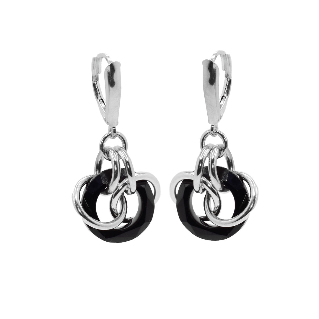 These sterling silver crystal earrings have jet Swarovski crystal hoops with several silver hoops linked through them. The crystals hang from small silver hoops and there are two large ones linked through the crystal and the top links.