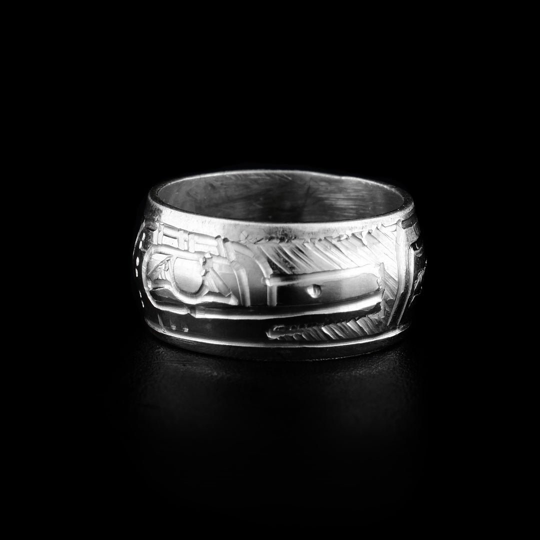 These bead charms are made from sterling silver and are round beads with a flat band. There is a depiction of the head of the Hummingbird carved around the piece with its beak, wings, and eyes detailed.
