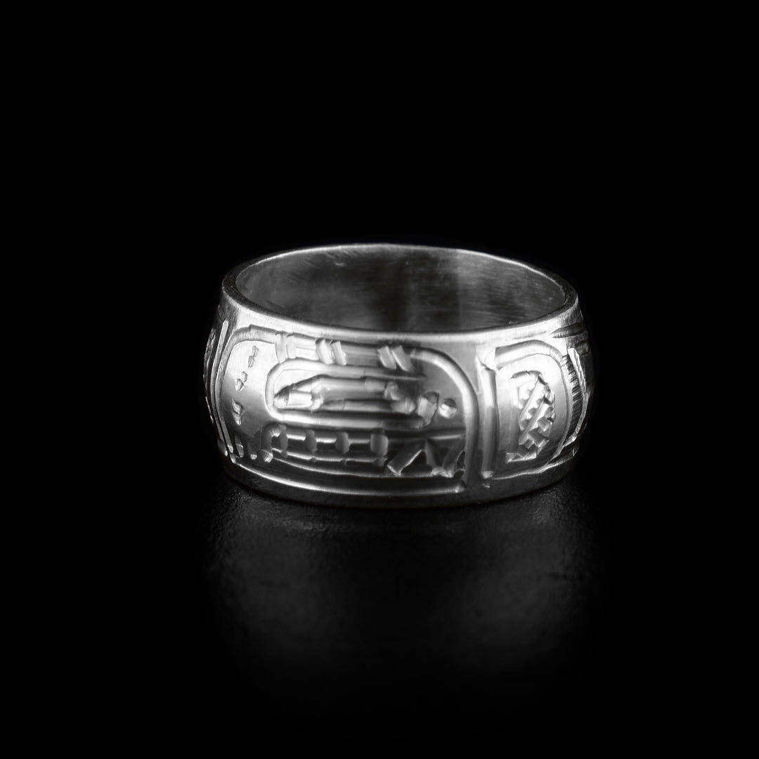 These bead charms are made from sterling silver and are round beads with a flat band. There is a depiction of the head of the Orca carved around the piece with its teeth, eyes and dorsal fin detailed.