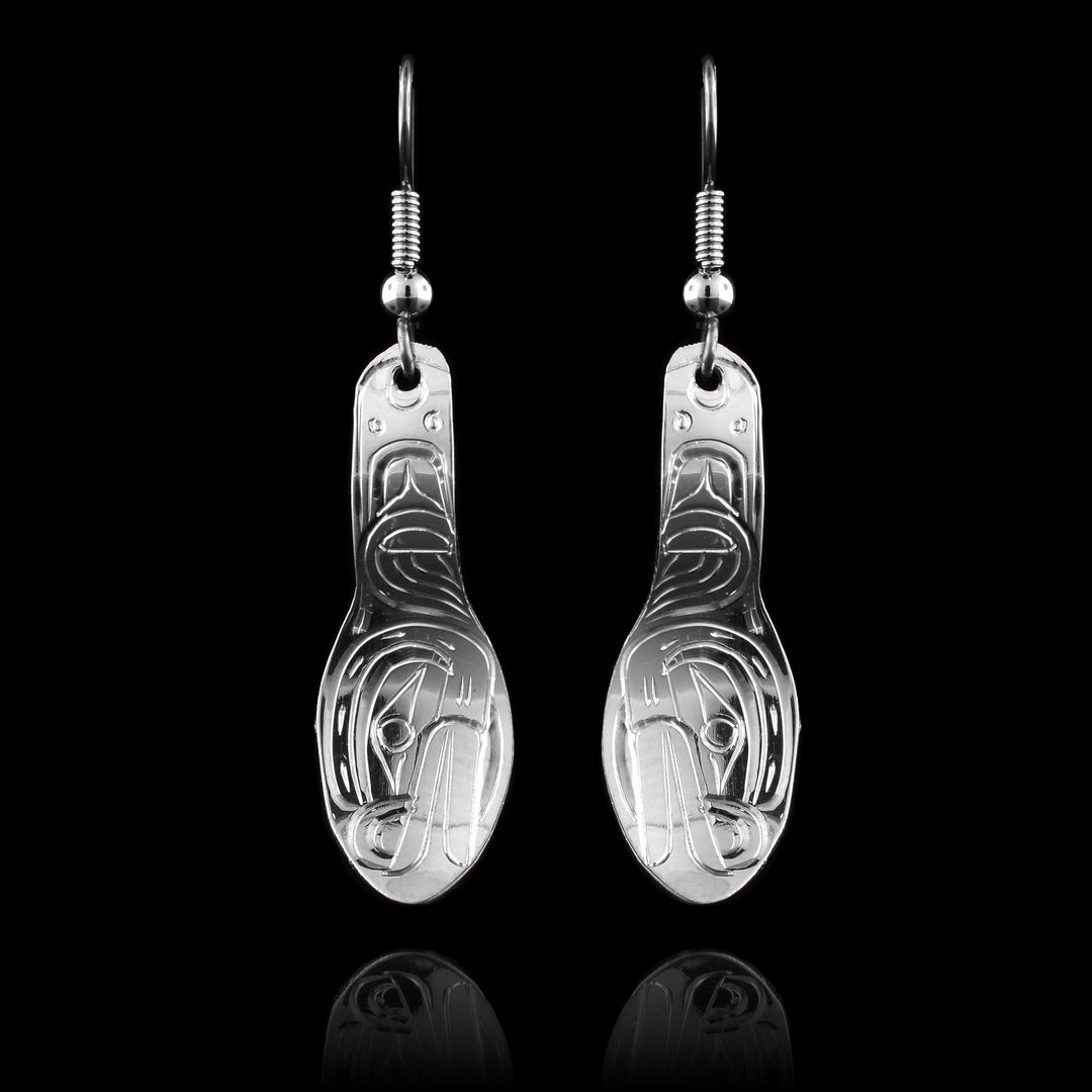 These dangling spoon earrings are made from sterling silver and are shaped like flat spoons. The head of the Frog is carved into the bowl of the spoon at a side profile.