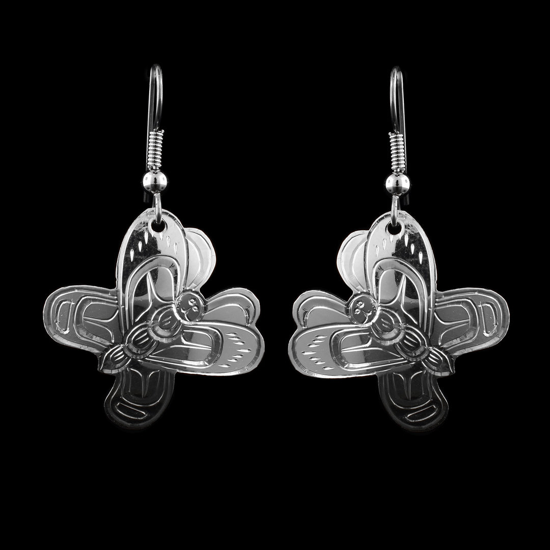 These butterfly wing earrings are made from sterling silver and are shaped like butterflies with their wings outstretched. There are carvings on the surface of the hangs detailing antenna, face, body and wing designs. 