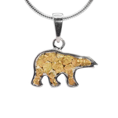 This gold nugget pendant has a sterling silver ring that is shaped like the side profile of a polar bear. The pendant is completely filled with 22K gold nuggets.