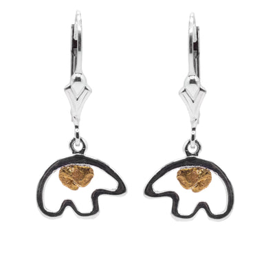 These gold nugget dangle earrings have cutout, sterling silver hangs that create the simple shaped of a bear at a side profile. There is a 22K gold nugget displayed in the center of each of the hangs.