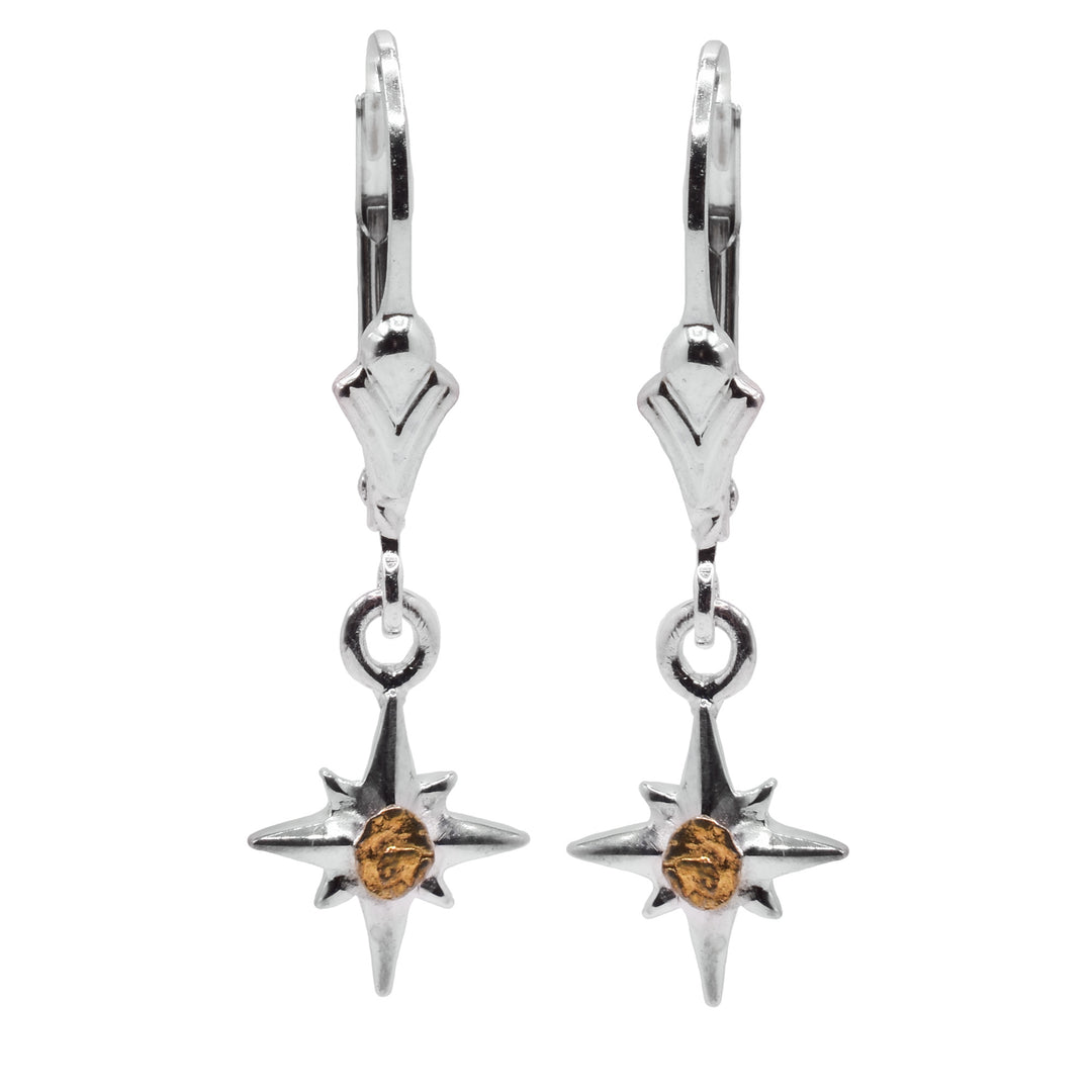 These gold star earrings have small, star shaped hangs made from sterling silver. They have four large points and dour smaller points between them. There is a 22K gold nugget in the center of the star hangs.