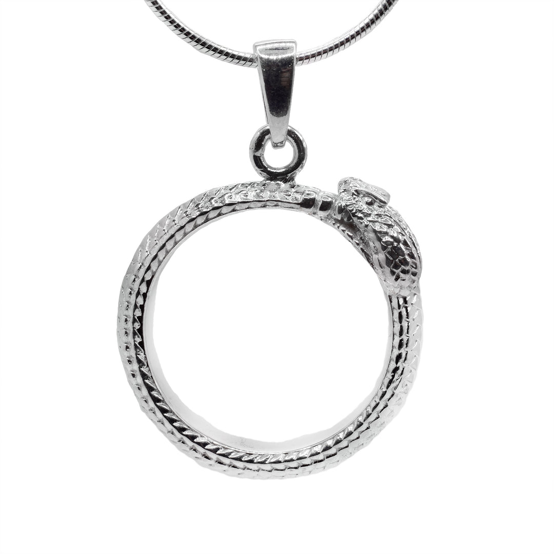 This ouroboros pendant is made from sterling silver and is shaped like a hoop. The piece is shaped like a snake holding its tail in its mouth and there are scale designs made all around it. The details of the head are also including with the mouth and eyes.
