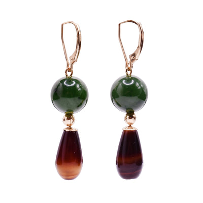 These jade and gold earrings has 14 gold filled lever back hooks with BC jade balls dangling from them. Below the jade are small, gold circles with teardrop shaped agate dangling from them.