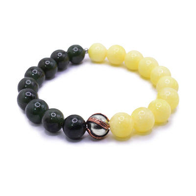 This yellow agate bracelet has small, sphere shaped beads made from yellow agate and BC jade. Half the piece is jade and the other half i yellow and the other is jade. There is a bead charm in the center that is a silver ball with bands of copper wrapped around it.