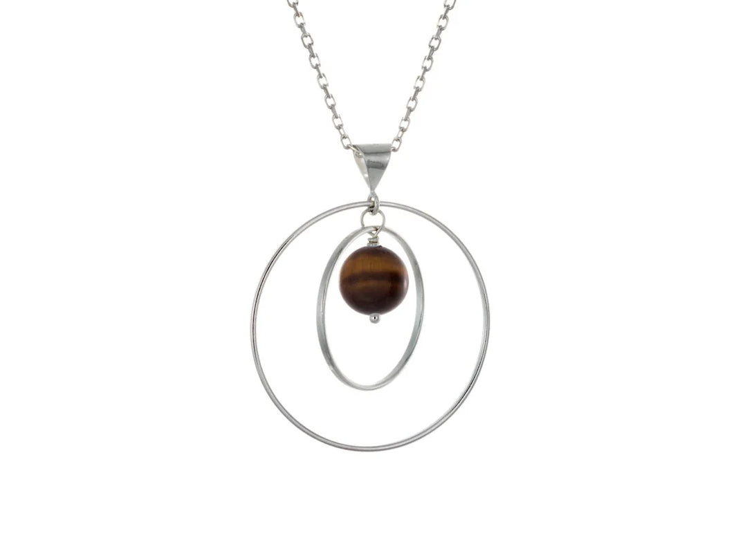 This tiger's eye necklace has a large sterling silver hoop with a smaller hoop in the middle of it and a sphere shaped tiger's eye bead in the center of them. All of these pieces are suspended and can orbit around each other.
