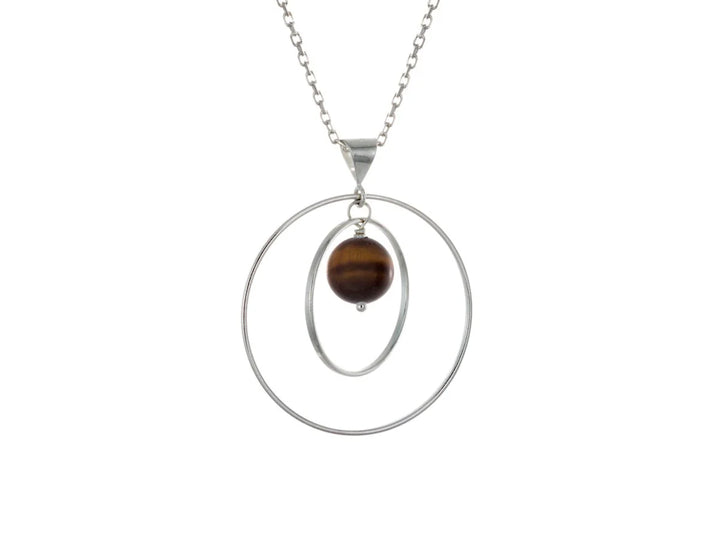 This tiger's eye necklace has a large sterling silver hoop with a smaller hoop in the middle of it and a sphere shaped tiger's eye bead in the center of them. All of these pieces are suspended and can orbit around each other.