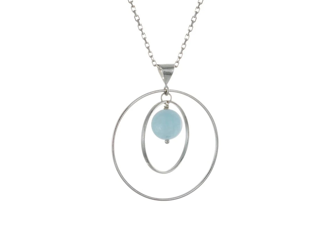 This aquamarine necklace has a large sterling silver hoop with a smaller hoop in the middle of it and a sphere shaped aquamarine bead in the center of them. All of these pieces are suspended and can orbit around each other.