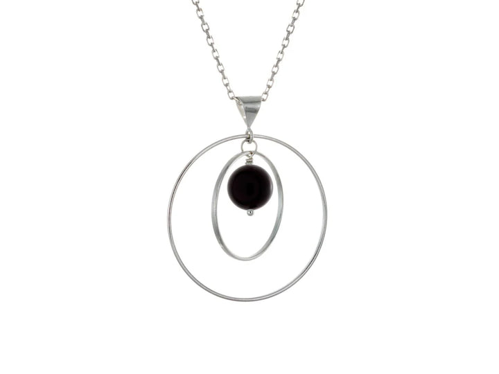 This black onyx necklace has a large sterling silver hoop with a smaller hoop in the middle of it and a sphere shaped black onyx bead in the center of them. All of these pieces are suspended and can orbit around each other.