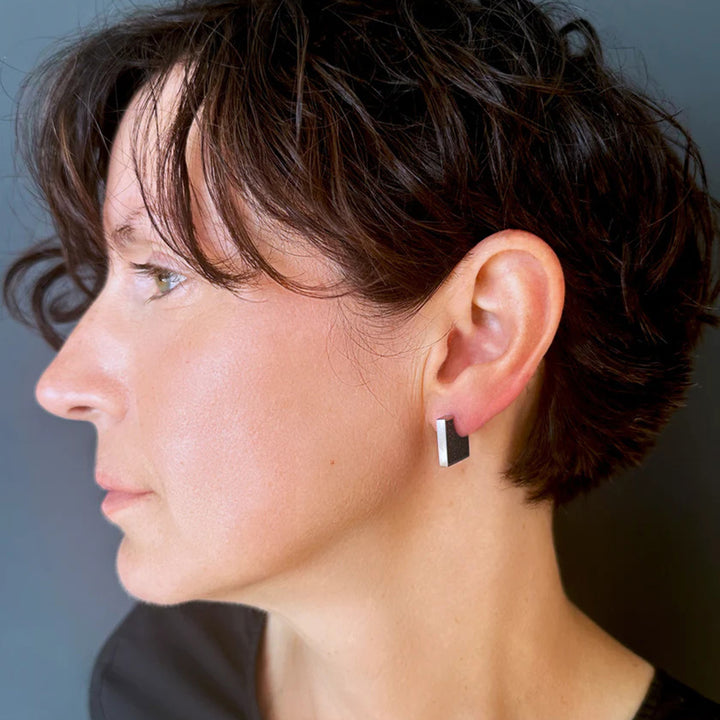 This picture shows the stainless steel stud earrings on a female model.