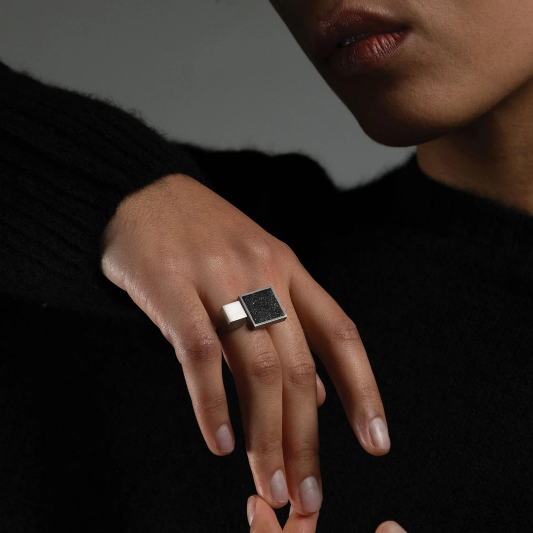This picture shows the stainless steel ring on a female model's hand.