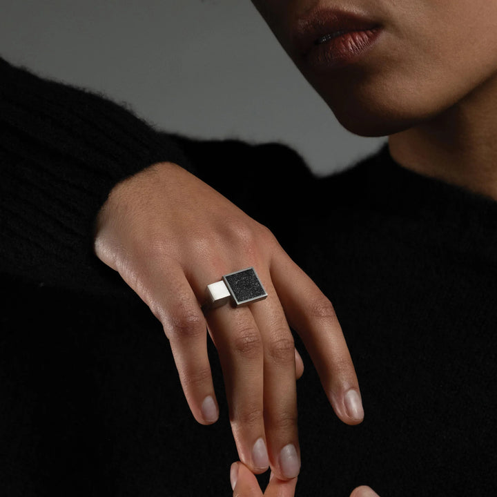 This picture shows the stainless steel ring on a female model's hand.