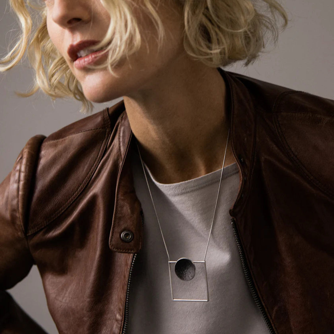 This photo depicts the stainless steel necklace on a female model.