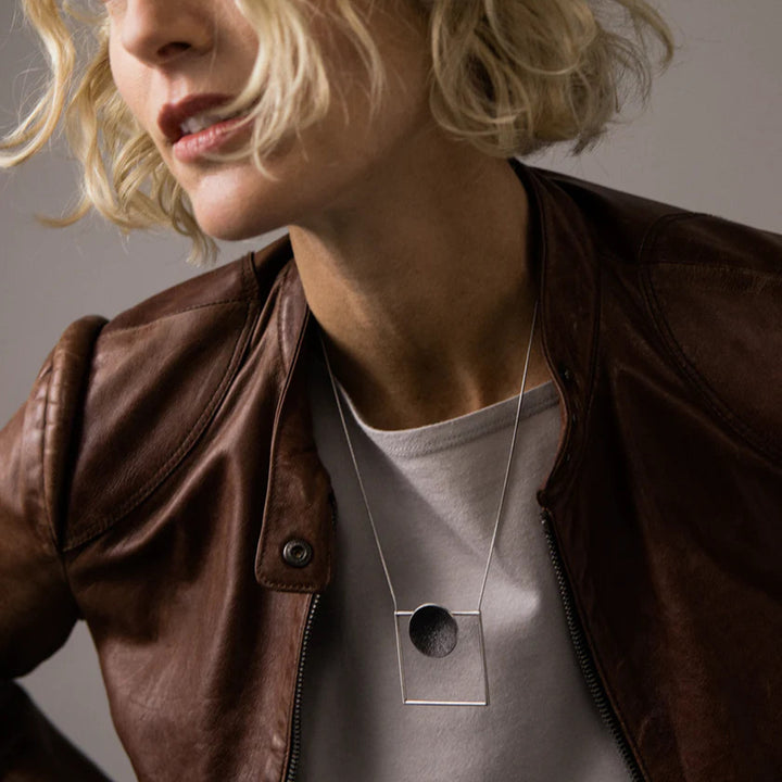 This photo depicts the stainless steel necklace on a female model.