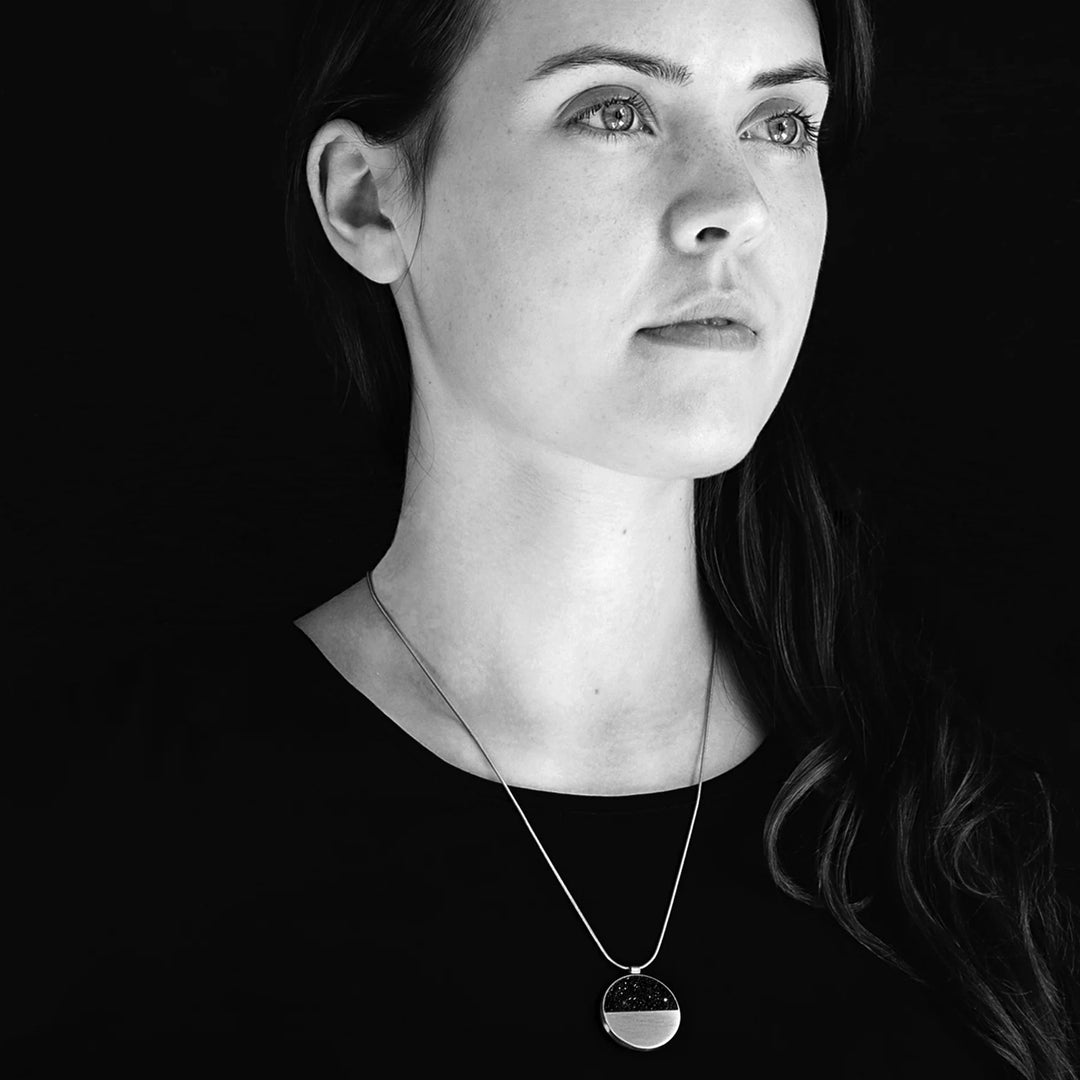 This photo shows the stainless steel necklace on a female model.