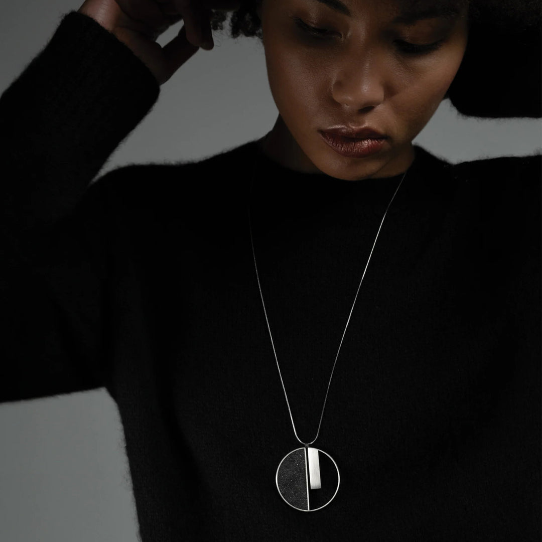 This photo shows the stainless steel necklace on a female model.