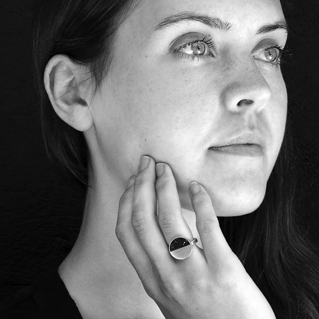 This photo shows the stainless steel ring on the hand of a female model.
