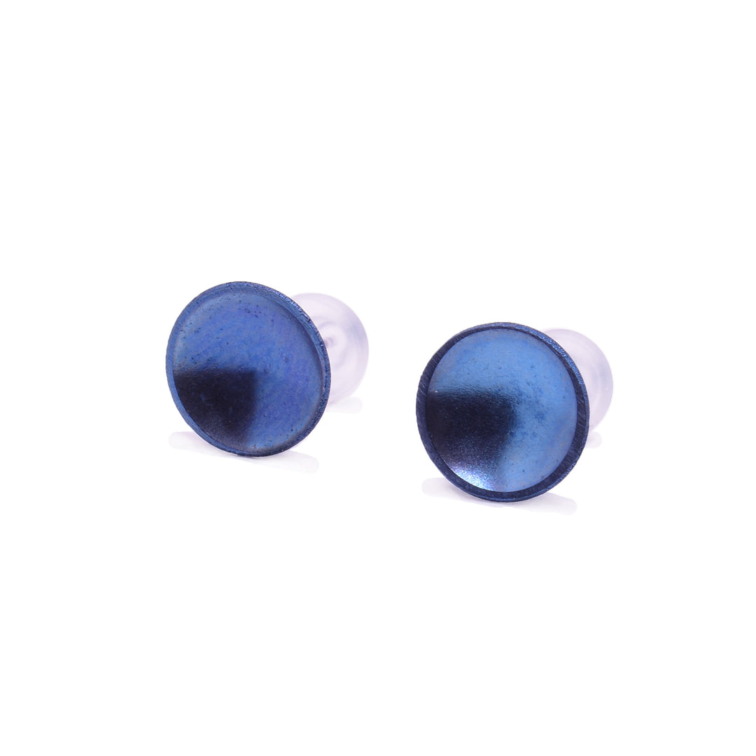 These titanium earrings studs have a small, circle shape with a deep concave. The studs have a shiny blue colour on their surface