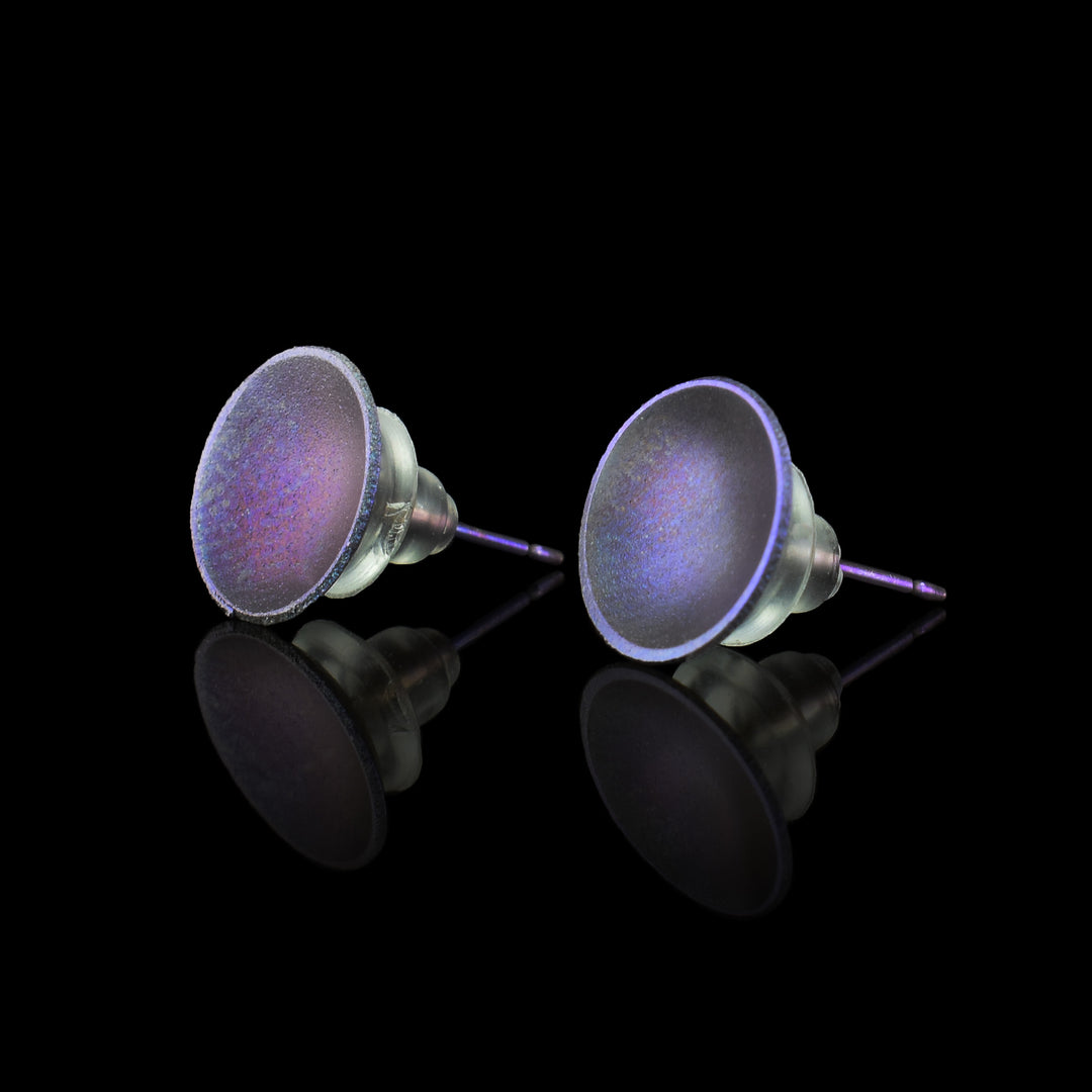 These titanium earrings studs have a small, circle shape with a deep concave. The studs have a shiny, purple colour on their surface.