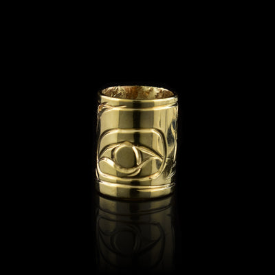 This 10K gold Orca charm is a long, cylinder bead that has the head of the Eagle carved into it.