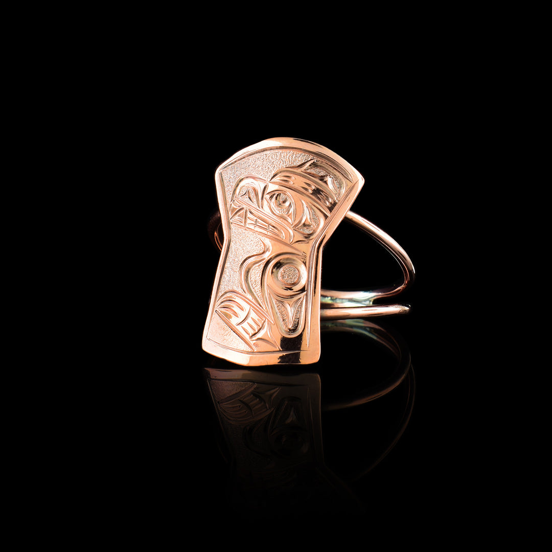 this Joe Descoteaux Bear ring. Hand-carved with a unique shield-shaped face made out of copper and uses two bands to show the legend ontop.