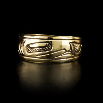 This gold ring depicts the face of the Salmon. Its body is pictured on the rest of the ring.