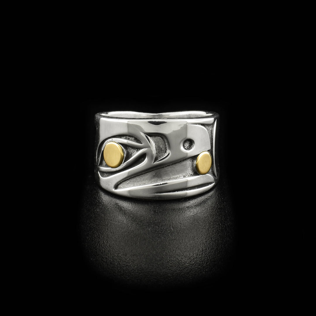 Front of ring depicts side-view of raven’s head facing left. The pupils and the ball in the beak are made of 14K gold. Rest of ring is sterling silver, oxidized in areas to give the design more depth. Size 8 ring design has larger gold ball.