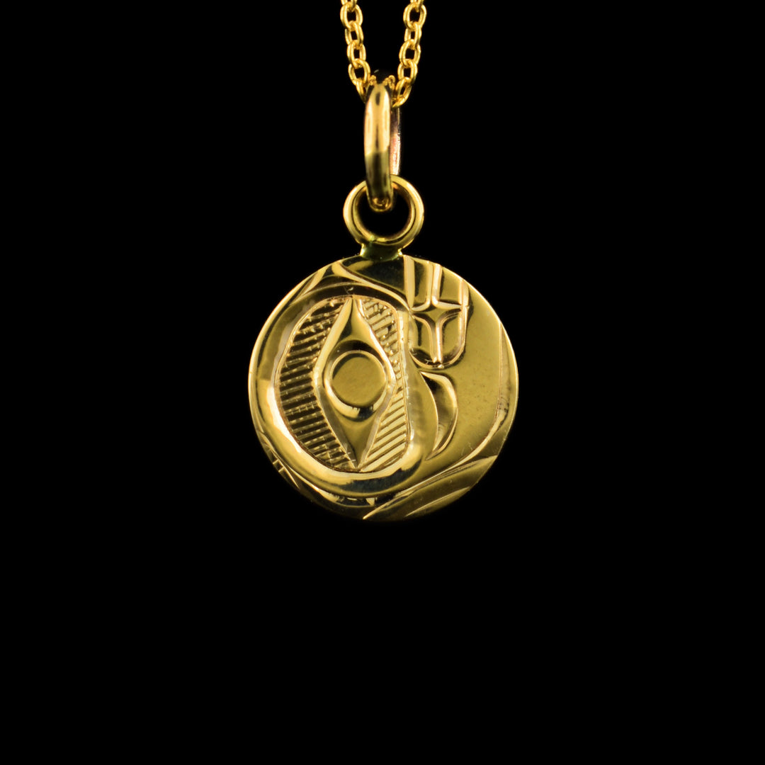 Hand carved 14k gold circular Bear pendant.