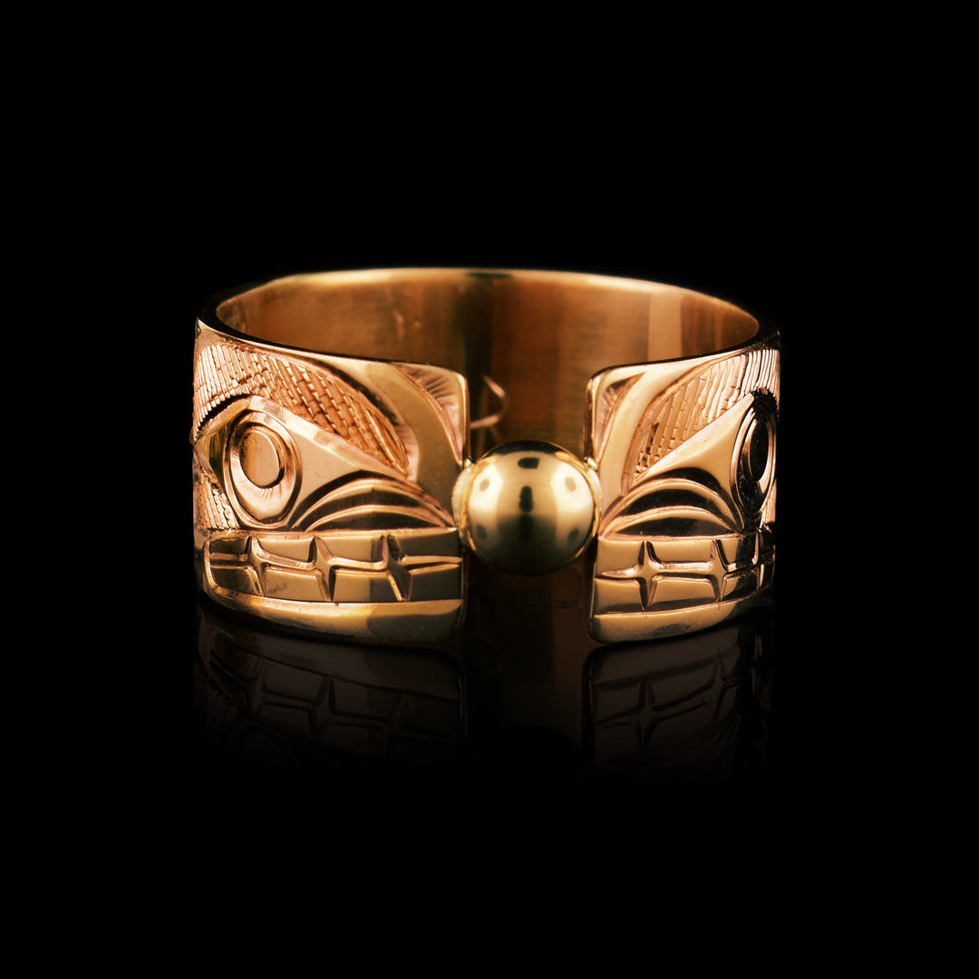 14k gold Orca split ring, 3/8" wide the band has the Orca legend carved in on both sides. It is split down the middle with a small gold sphere holding the two ends together. 