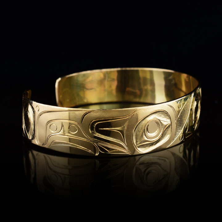 Right side of the gold cuff bracelet depicts the beautiful wing of the Hummingbird.
