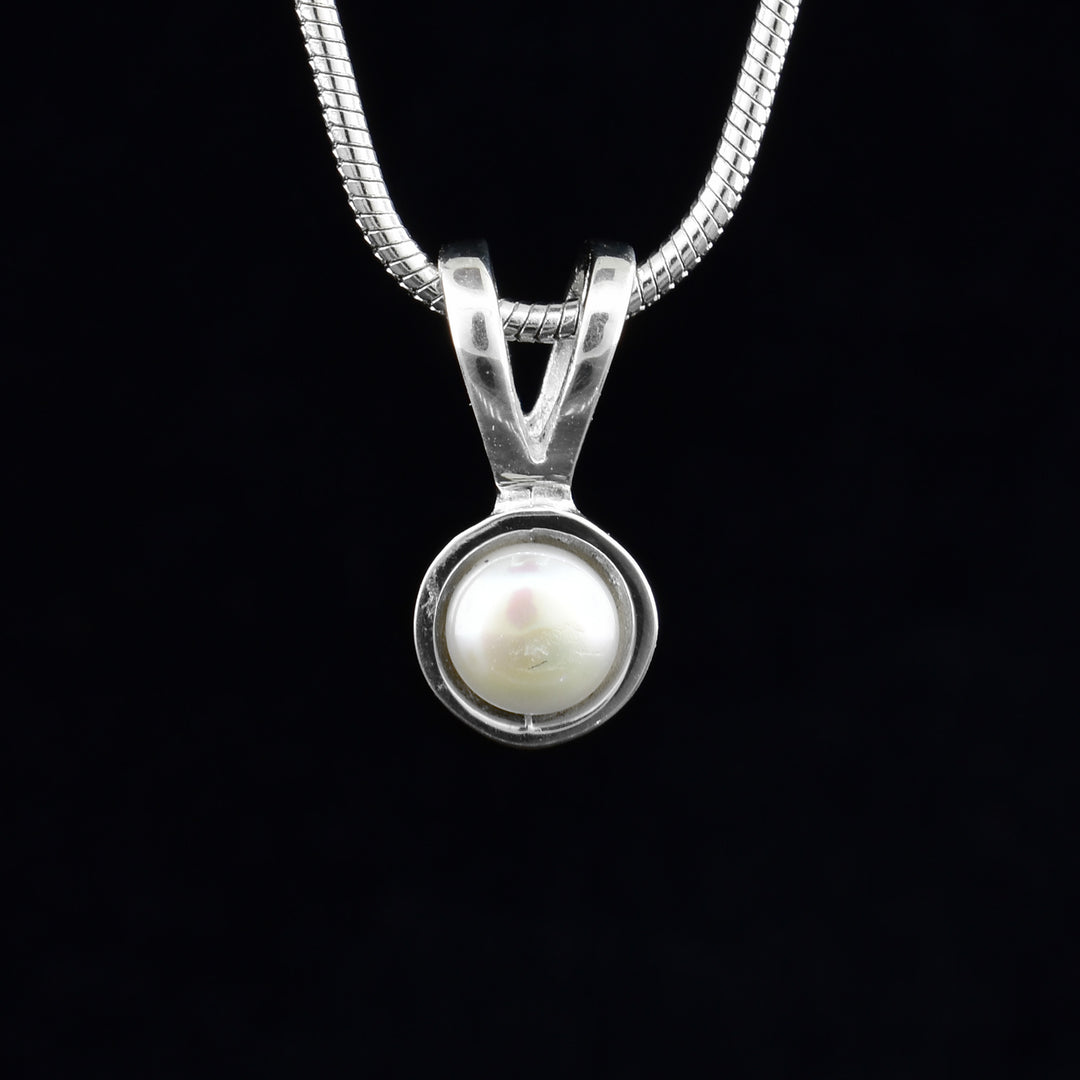 Sterling silver dainty white freshwater pearl pendant by Ivan Dobren.