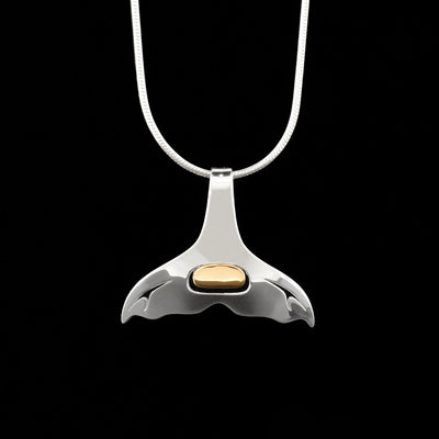 Minimalist pendant with some cut out designs. Central ovoid is 18K yellow gold and rest of piece is sterling silver. Top curls over so chain can be inserted through back.