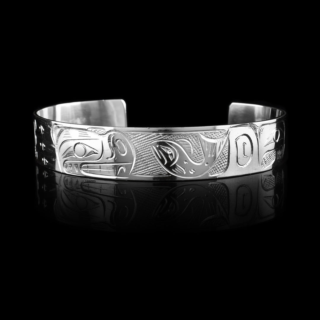 1/2" Bear and Salmon Silver Cuff - Sold at Artina's this cuff is hand carved with the legend of the Salmon and the Bear. It is crafted with sterling silver.